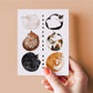 Easter Egg Hunt card featuring six cats curled up like eggs: white cat, black cat, tuxedo cat, brown tabby cat, calico cat, and an orange cat mom with her kitten. Perfect for cat lovers!