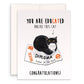 Black and white tuxedo cat lounges on a bent diploma in a cute and funny graduation card. Caption: &#39;You are edu-cat-ed, unlike this cat—congratulations!&#39; Ideal for cat lovers and recent grads with a sense of humor.